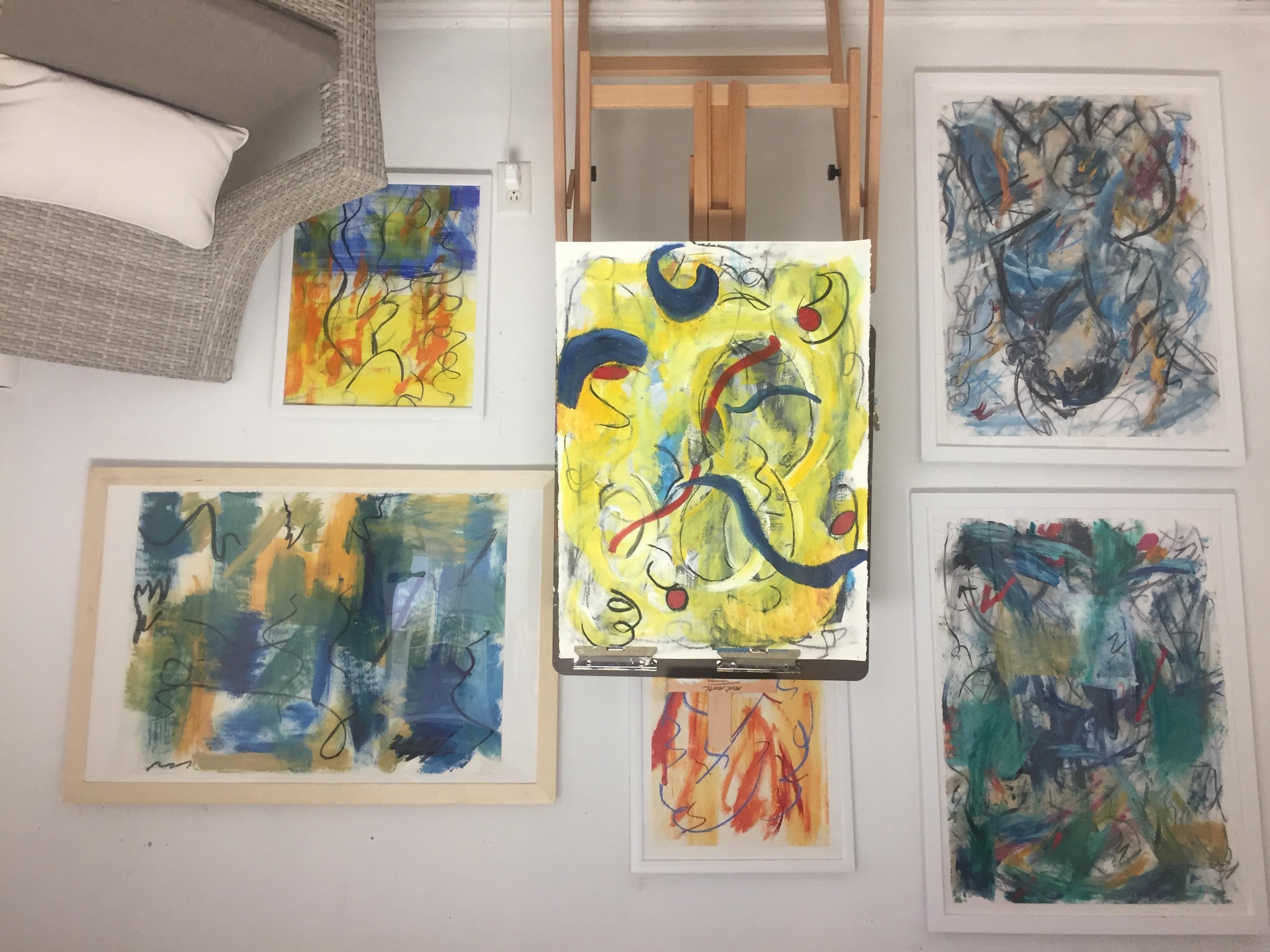 multiple paintings in the studio